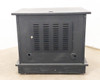 Rear view of multimedia TV cabinet showing large louvered ventilation panel and two round cable pass-through ports at base