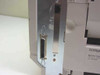 Lexmark Optra K 1220 rear panel showing Centronics parallel port connector with partial Lexmark label and machine type label
