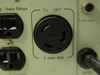 Minuteman PML2000 rear panel close-up showing NEMA 5-30R twist-lock output rated 30A max and T 25A/125V fuse holder detail