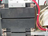 Minuteman PML2000 interior showing two battery cases stacked in battery compartment with red wiring harness and internal components visible