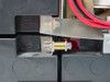 Minuteman PML2000 battery terminal connector close-up showing bolt-type battery post connection hardware