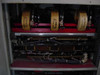 Emerson AP340 UPS – lower interior detail showing three toroidal transformers and bus bar assembly on red shelf