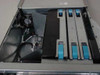 IBM 7026-W80 RS6000 – interior top view showing empty hard drive bays and expansion card slots with blue pull tabs