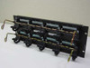 Lucent PatchMax 110 telephone cable rack patch panel – front-angle view showing four IDC block modules and gold cable management hooks