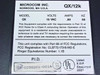 Microcom QX/12K bottom label showing model QX, 19VAC 0.80A 60Hz, FCC registration CLB772-17318-MD-E and UL listing