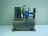 Brunner Engineering 3.8 Gal Air Station Tank front view showing dual Dwyer flow meters on left, central water separator filter, and inlet regulator on right