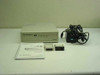 Motorola FT100M Managed Fractional T1 DSU/CSU – front view with included manual, Ault power supply, and DB-25 adapter