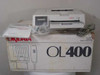 Okidata OL400 EN2510A LED Page Printer sitting on original OL400 box with documentation and cable