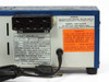 Micro Star MS-136 rear panel angled view showing outlet block, rating plate specs, and attached AC cord