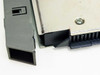 IBM 5822-018 close-up of broken plastic on face cover latch — damage detail view