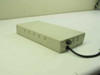Andrew TRR 8218L Token Ring Router rear and side view showing vented metal enclosure with attached power cord
