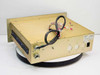 Vindicator RMC-2100 rear and side view showing back panel with power inlet, knockouts, and wiring harness routed over the gold chassis