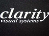 Close-up of Clarity Visual Systems logo on textured black cabinet surface