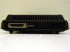 Microcom AX/2400C external modem – rear panel showing DB-25 RS-232 serial port, DIP switches, and RJ-11 phone line connectors
