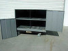 Steel cabinet with both doors open showing 4 interior compartments divided by a center shelf, with casters visible