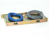 CCI RMC-1819-2-8 RX-AIT rear chassis view showing gold-iridite rack tray, blue and gray cables, and small wiring harness