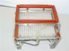 UV light frame side view showing red-sealed upper UV lamp housing lifted on pneumatic cylinders above lower tray section with visible clear flex tubing