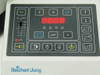 Reichert-Jung 2050 remote control panel close-up — 4-digit LED display, membrane keypad with speed, thickness (µm), quantity (n) controls, and STOP button