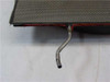 Stainless steel air circulation plate — close-up of edge and metal tube stub fitting with orange foam gasket seal visible