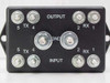 Northern Technologies TCS-T1DS front terminal view showing OUTPUT and INPUT rows with TX 4/5 and RX 1/2 double-lug screw terminals and GND posts