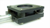 Oriel anti-vibration mirror mount side view showing rubber isolation pads beneath black aluminum body and stem