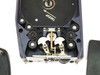 Photo-Sonics 16mm-1VN Film Magazine — close-up interior view of film transport mechanism with brass film guides, rollers, and takeup direction arrow