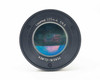 Perkin-Elmer Lasermat 225mm f/4.5 Collimator Lens straight-on front element view showing coating condition with visible iridescent wear patches