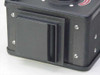 70mm film magazine – close-up of film slot/gate opening and sliding dark-slide cover on the bottom edge
