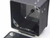 70mm copy camera film magazine – top open showing interior film transport spindle and drive pin mechanism, lid removed