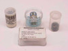 Gastech GX-91 kit detector sensor components: two canisters, loose sensor element, and labeled detector package reading 'CAGE OWK23 P/N 61-0220 DETECTOR, GAS 1 EA'
