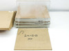 Full lot overview — wrapped stack of thin 14x14 glass plates beside cardboard box labeled 1/4TK x 12x12 PFP