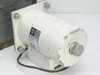 Rear and side view of Giannini Scientific 205-071-7 motor assembly showing cylindrical white motor body, flange mount, output shaft, and attached cable with green asset tag