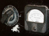 Elicon Ultradrive 600 detail — small rotary control dial and Simpson alternating current milliammeter (0–200 mA range) on instrument panel; white powder residue visible around dial
