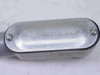Top view of LB conduit body cover showing UL 1/2 marking and COVER E30640 stamp with screws and partial label visible