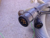Multi-pin circular interconnect connectors and corrugated coolant hoses from the laser system