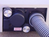 Laser head rear output panel with multiple adjustment knobs, beam port, and DANGER radiation warning label