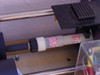 Internal laser head detail showing output end optics mount, mirror adjustment hardware, and DANGER radiation label