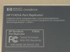 HP F1451A Port Replicator label closeup showing model number, FCC compliance, and Canadian EMC Class B certification