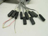 K100D logic analyzer probe set — multiple IC clip-style probe tips on flat ribbon cable with two loose wire leads
