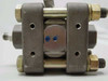 Schlumberger Statham PM6142 – front face showing center hex plug, body bolt hardware, and two blue-dot markings on center diaphragm cap