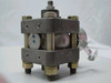 Schlumberger Statham PM6142 – opposite side view showing NPT male port fittings top and bottom, inventory tag attached