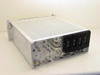 Microdyne 1400-MRA Telemetry Receiver rear three-quarter view showing perforated top cover, partial rear panel BNC connectors, and large black heat sink fins on right side