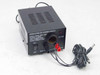 PHC-412J Regulated 13.8VDC Power Supply front panel showing ON/OFF rocker switch, cigarette lighter output socket, red and black binding posts, and attached DC barrel jack cable