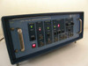 Tau-Tron STX-1101 Bit Error Rate Transmitter – straight-on front panel view showing GPIB/RS-232 mode section, Clock, Data Pattern, Error Inject, Sync Outputs, and Data Output controls with indicator LEDs