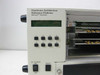 APW HARP chassis front panel close-up showing 'Hardware Architecture Reference Platform Microsoft Hardware' label, 8 numbered buttons, LCD display, DC Power On/Off switch, and Reset button
