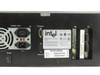 Intel KEIXP12EBAA rear panel detail — power section (115/230V, 1/0.5A label), Console DB-9, Async port, E0 and E1 Gigabit port cage assemblies visible