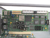 Intel network processor evaluation board close-up — green PCB with large central processor/ASIC, small cooling fan, Pulsar/PMC ICs, multiple RJ45 ports (ports 1–8 visible), PCI edge connector, and ribbon cable connectors