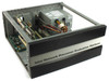 Intel Network Processor Evaluation Platform KEIXP12EBAA — three-quarter front view showing brushed-metal faceplate label and open chassis with internal PCI backplane and power supply