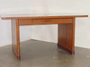 Executive 3460 wood-finish office desk with single drawer – three-quarter front view showing panel base and slab legs