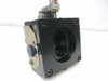 Rear view of linear stage optical mount showing circular bore, mounting screws, brass hardware, and fine-thread adjustment knob